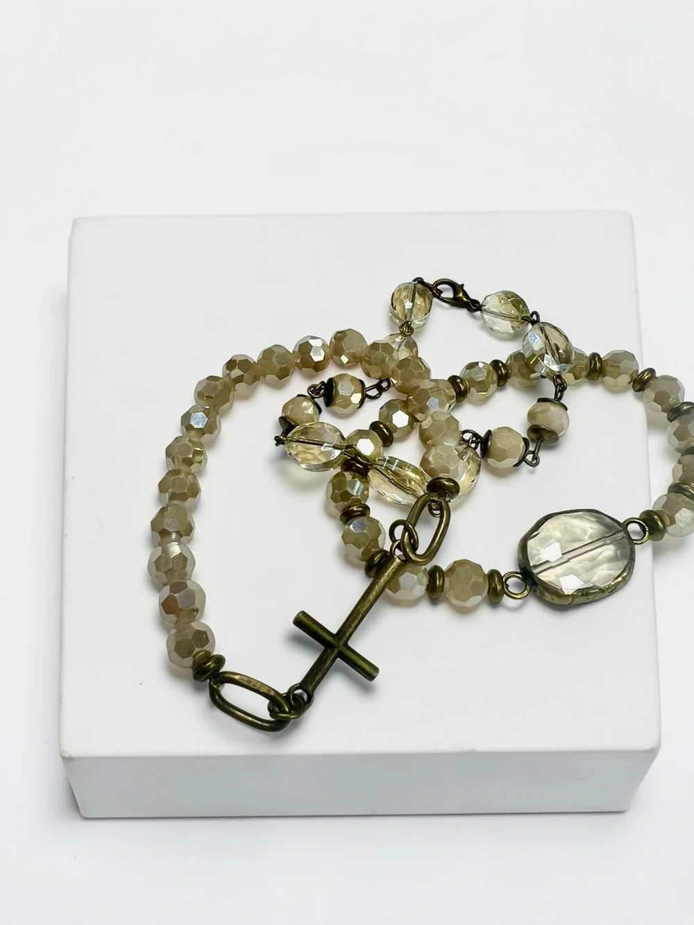 Elegant ivory-champagne Beaded Cross Bracelet